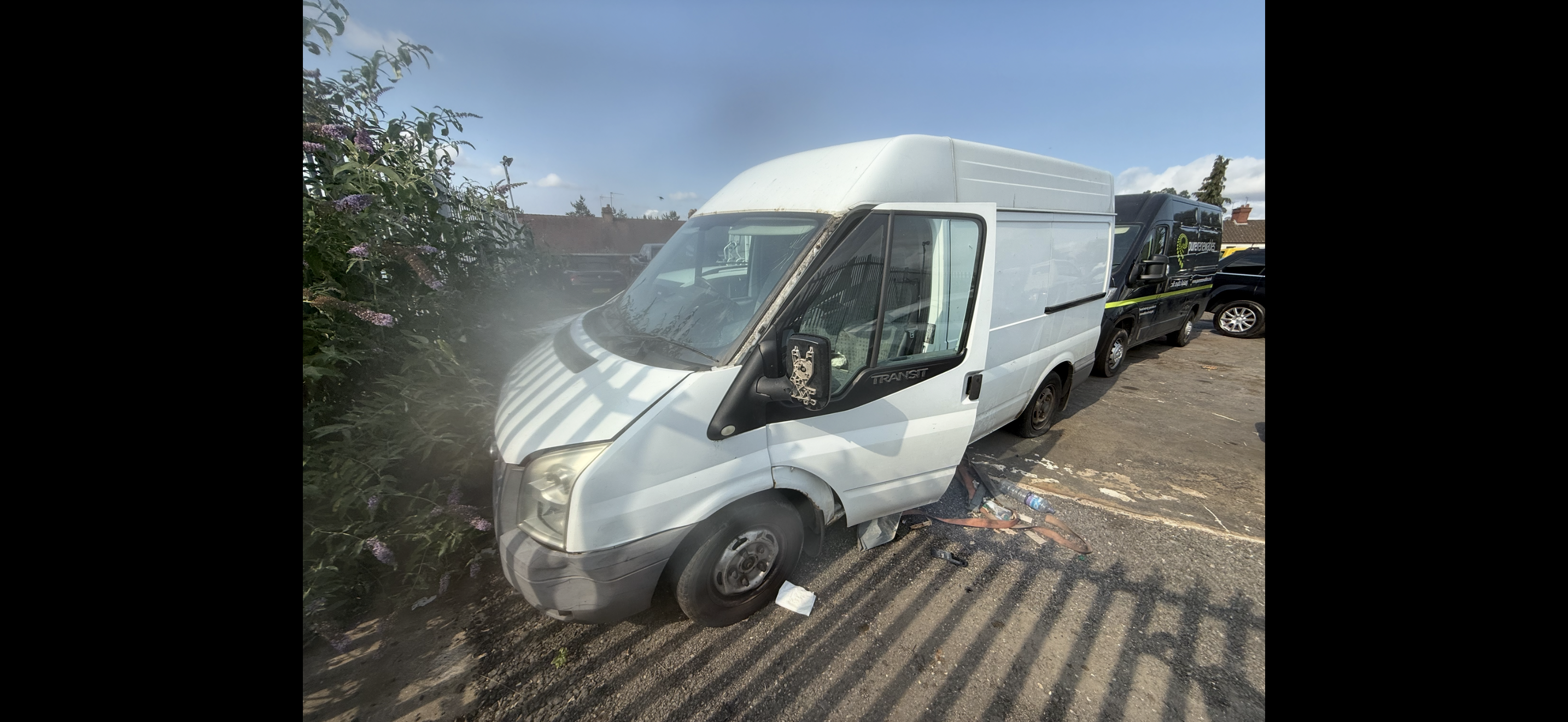 Abandoned white Transit van removed from private parking bay
